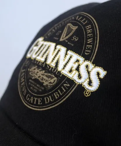Guinness Baseball Cap with Extra Stout Bottle Label Print and Bottle Opener on Peak, Black Colour (One Size)…
